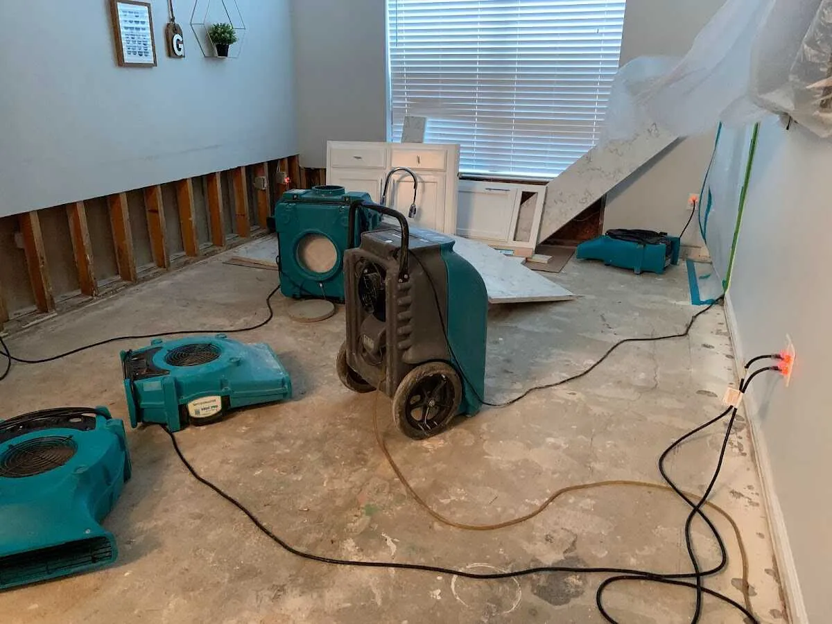 Dehumidifier in flood-cut room for Water Damage Restoration in Roxbury